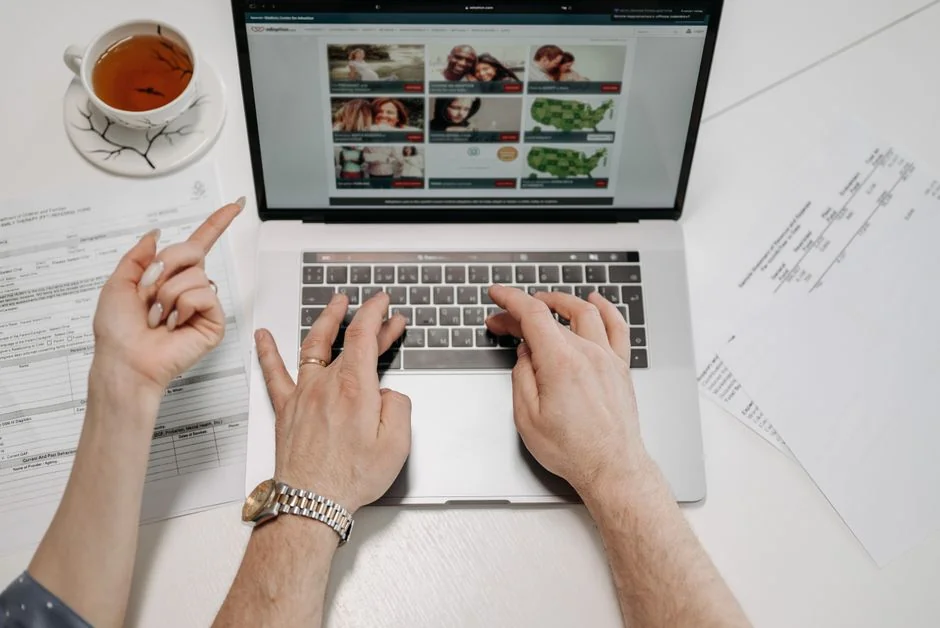 A contemporary computer display showing web design projects, highlighting creative visuals in a work setting.